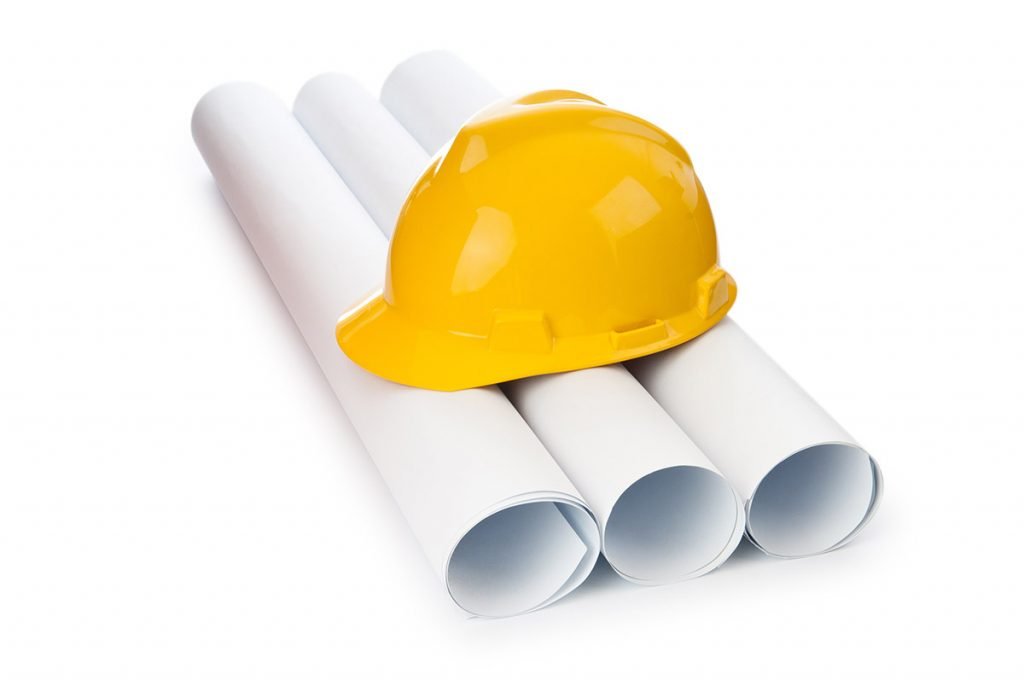 construction helmet on construction plans