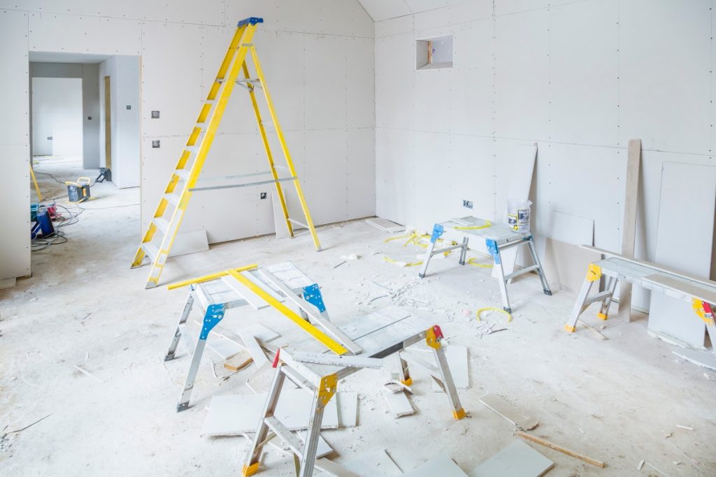 empty property being painted with commercial property insurance
